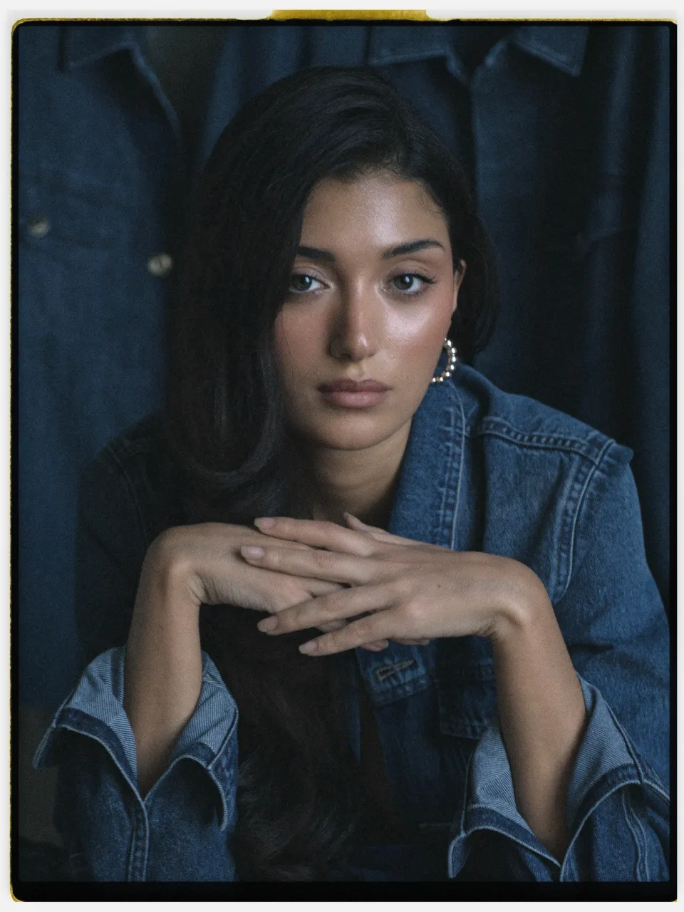 Cira 200 film stock in Chromogen, an easy consumer negative scan: a studio portrait in a denim jacket on an instant-style print