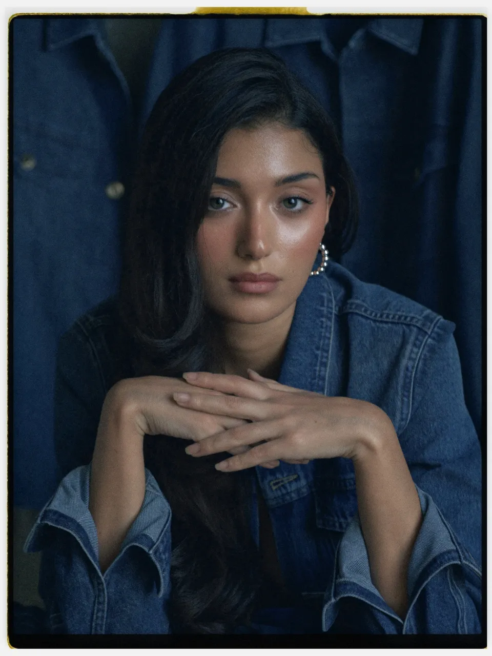 Meridian 250 film stock in Chromogen, a daylight cine film: a studio portrait in a denim jacket on an instant-style print