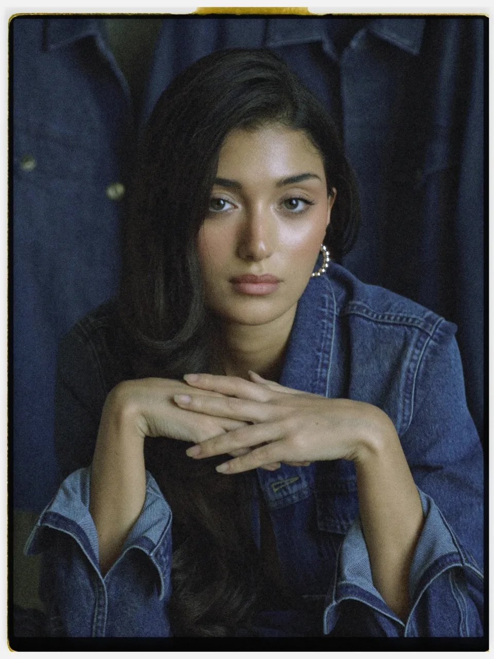 Vesper 400 film stock in Chromogen, a classic consumer negative: a studio portrait in a denim jacket on an instant-style print