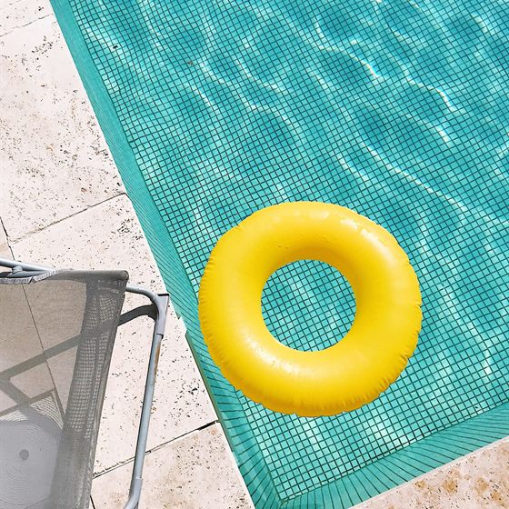 Library photo: a yellow float on a turquoise pool