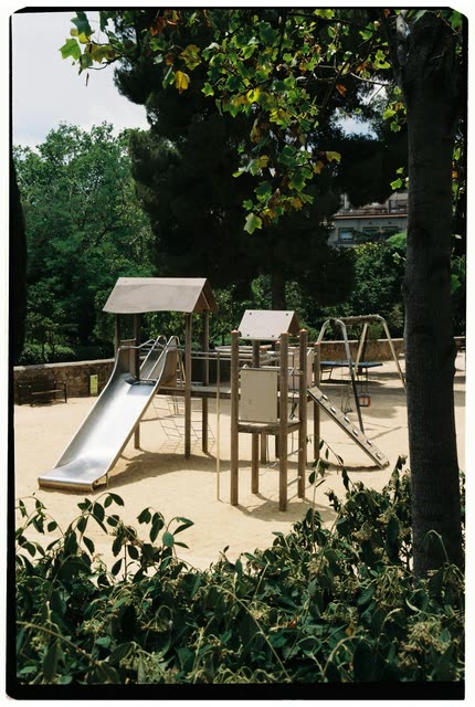 Scout photo on the moodboard: a playground slide under trees