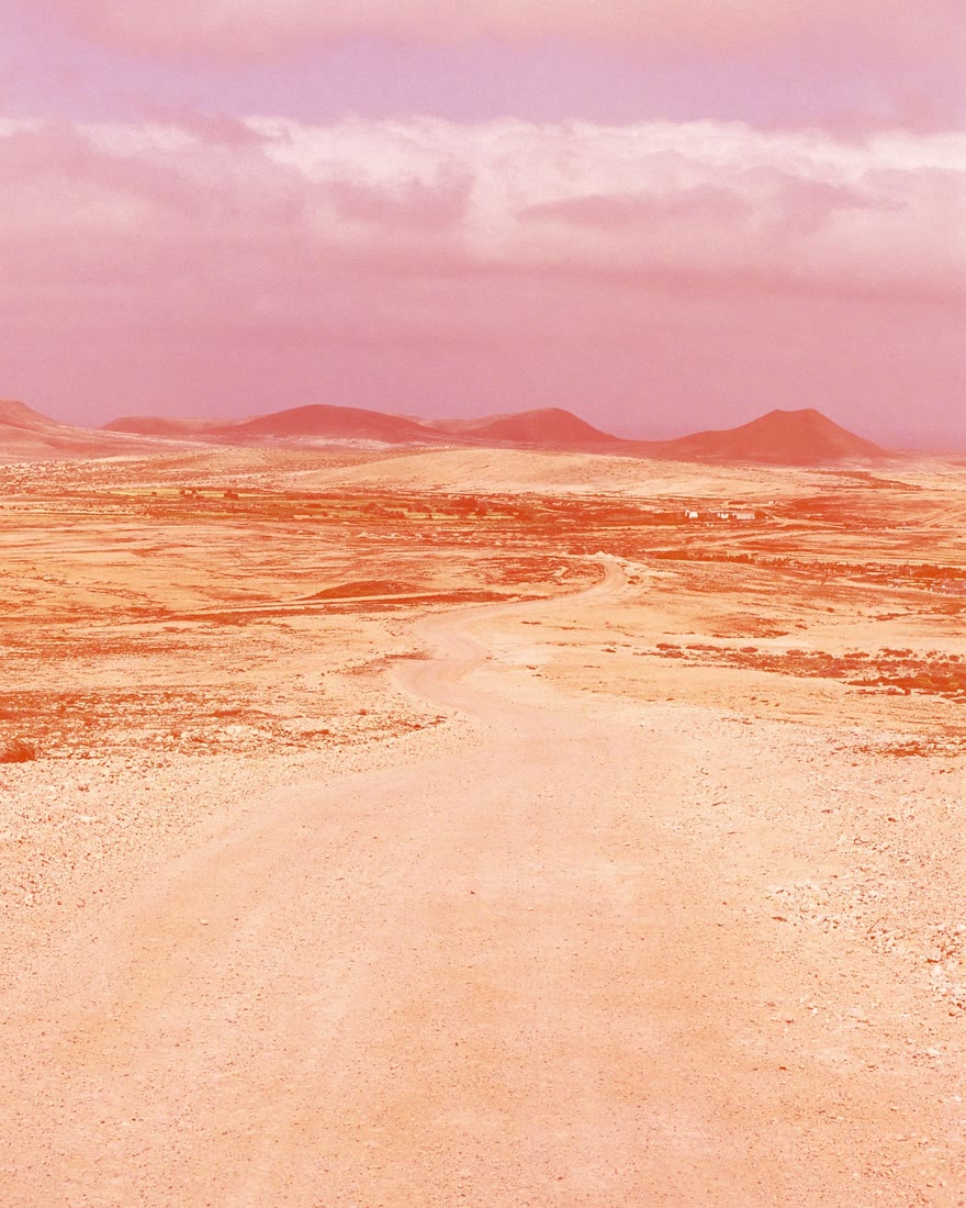 The same photo under a full veil, washed warm red from edge to edge